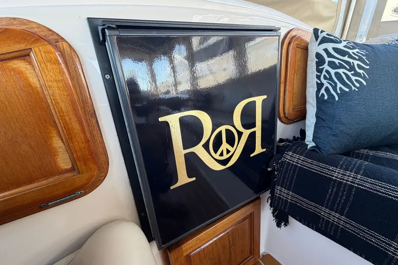 Slide: The Image of Interior of 2005 Duffy Classic 21 boat with custom black and gold design. - 17