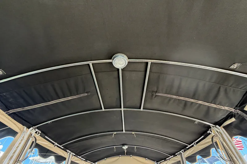 Slide: The Image of Interior view of a 2005 Duffy Classic 21 boat canopy with metal frame. - 24