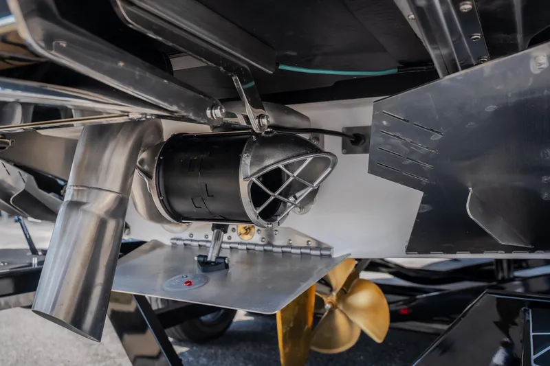 Slide: The Image of Close-up of 2027 Tigé Ultré 23ZX boat's propulsion system and propeller. - 23