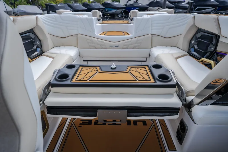 Slide: The Image of Luxurious interior of 2027 Tigé Ultré 23ZX boat with stylish seating and cup holders. - 64