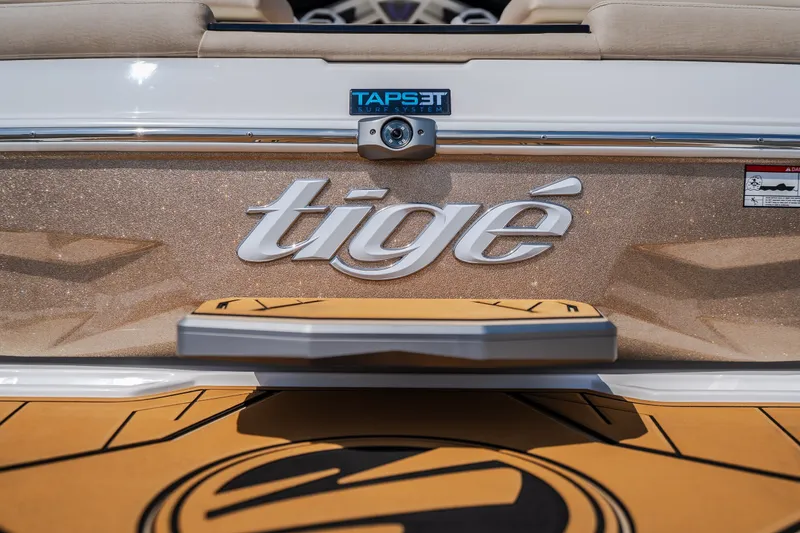 Slide: The Image of 2027 Tigé Ultré 23ZX boat rear view with TAPS 3T surf system. - 25