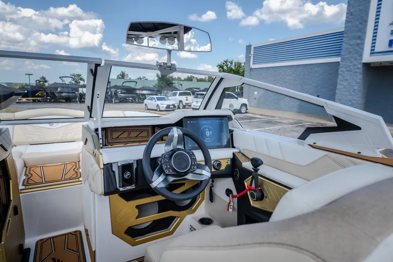 Slide: The Image of 2027 Tigé Ultré 23ZX boat interior with modern dashboard and steering wheel. - 34