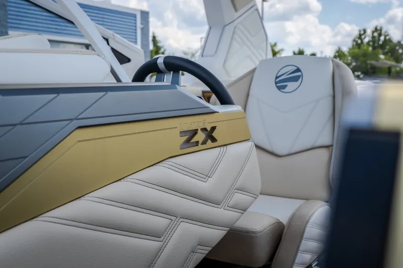 Slide: The Image of 2027 Tigé Ultré 23ZX boat interior with luxurious seating and modern design. - 52