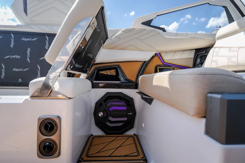 Slide: The Image of Interior of 2027 Tigé Ultré 23ZX boat with modern seating and speaker system. - 49
