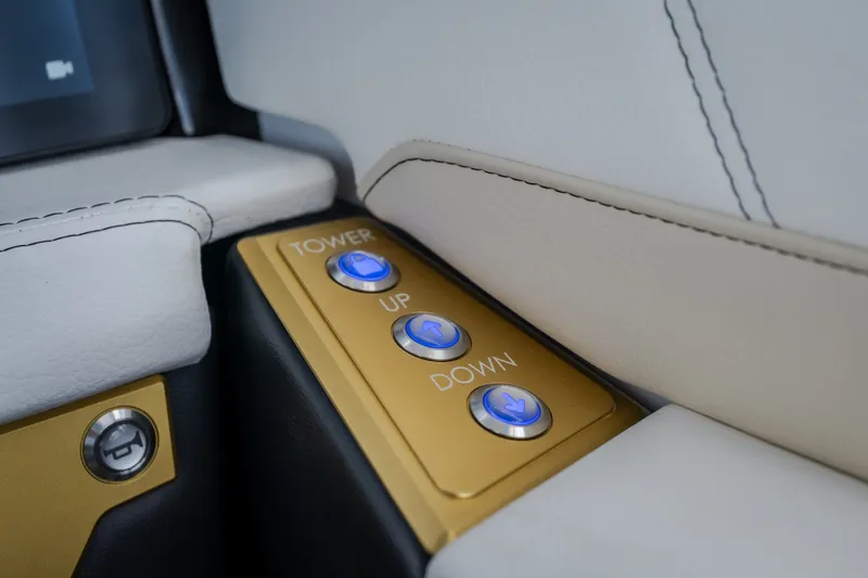 Slide: The Image of Control panel with illuminated buttons in 2027 Tigé Ultré 23ZX boat interior. - 40