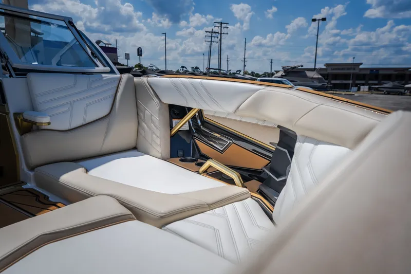 Slide: The Image of Luxurious interior of 2027 Tigé Ultré 23ZX boat with beige seating and modern design. - 71