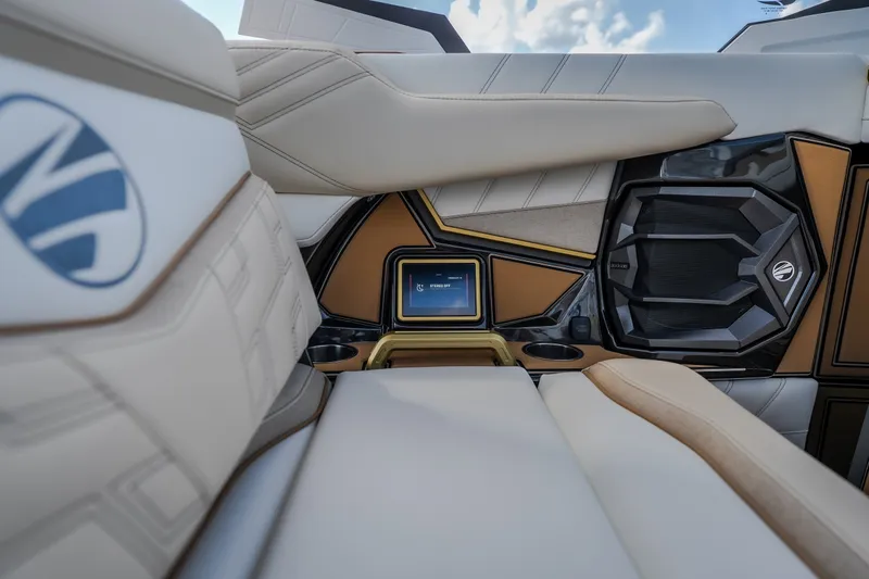 Slide: The Image of Interior of 2027 Tigé Ultré 23ZX boat featuring luxurious seating and modern control panel. - 46