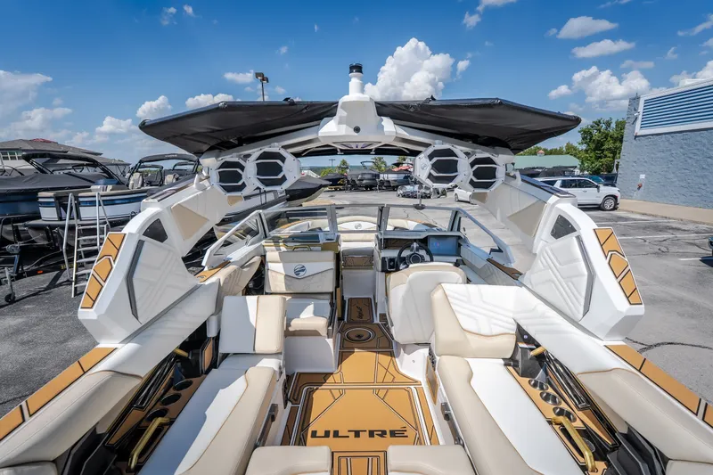 Slide: The Image of 2027 Tigé Ultré 23ZX boat interior with luxurious seating and advanced audio system. - 29