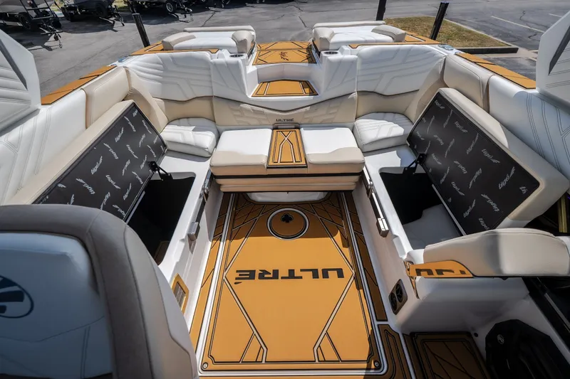 Slide: The Image of 2027 Tigé Ultré 23ZX boat interior with luxurious seating and storage compartments. - 57