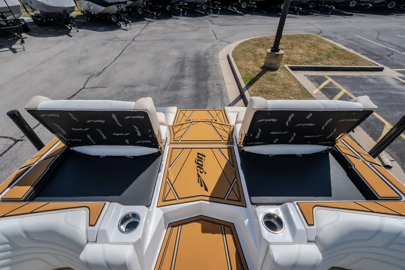 Slide: The Image of 2027 Tigé Ultré 23ZX boat interior with stylish seating and cup holders. - 58