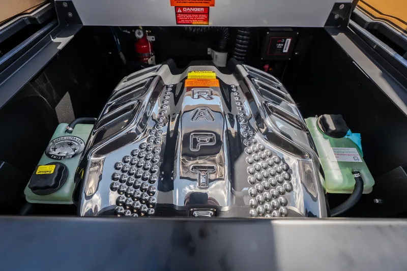 Slide: The Image of Engine compartment of 2027 Tigé Ultré 23ZX boat with Raptor engine cover. - 62