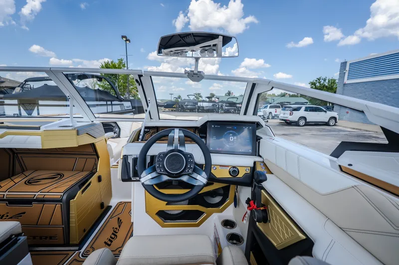 Slide: The Image of Interior view of 2027 Tigé Ultré 23ZX boat with modern dashboard and steering wheel. - 35