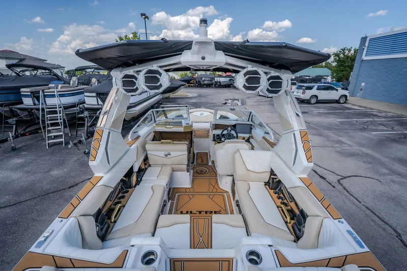 Slide: The Image of 2027 Tigé Ultré 23ZX boat interior with luxurious seating and advanced audio system. - 30
