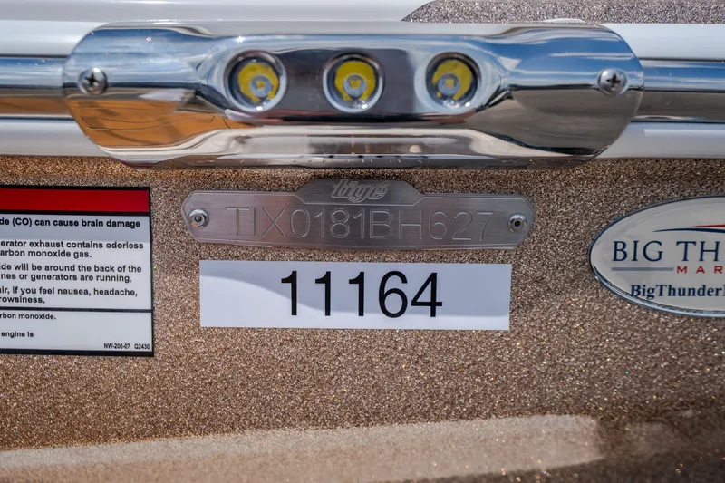 Slide: The Image of 2027 Tigé Ultré 23ZX boat with identification number TIX0181BH627 and label 11164. - 65