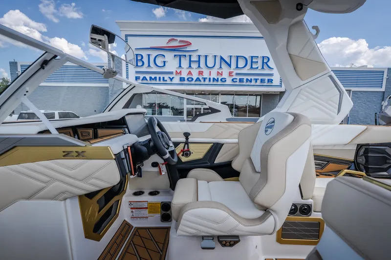 Slide: The Image of 2027 Tigé Ultré 23ZX boat interior at Big Thunder Marine Family Boating Center. - 33