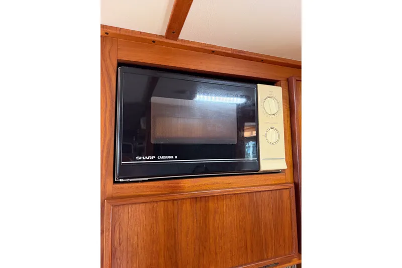 Slide: The Image of Sharp Carousel II microwave in 1990 Cruise-A-Home Corsair interior. - 59