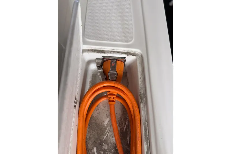 Slide: The Image of Orange power cable in a 1990 Cruise-A-Home Corsair boat compartment. - 73