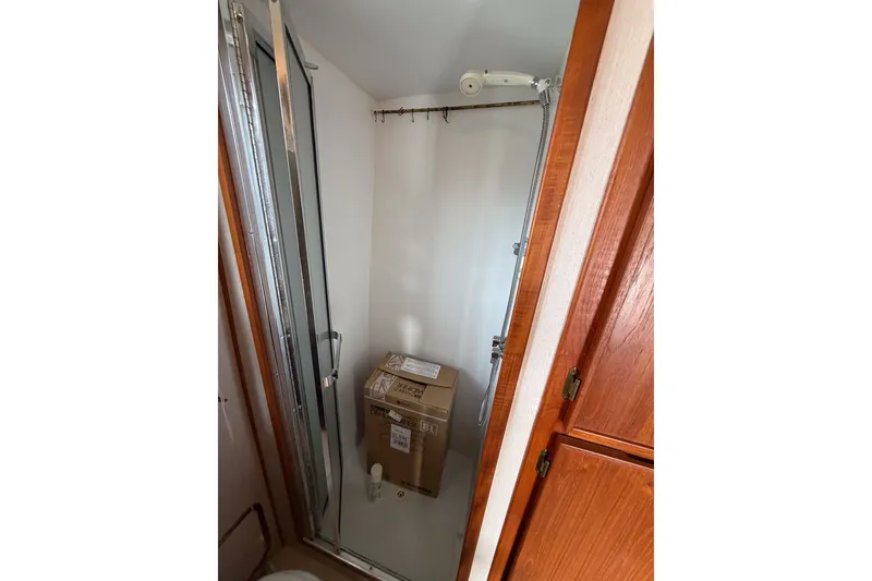 Slide: The Image of Shower area in 1990 Cruise-A-Home Corsair with cardboard box inside. - 35