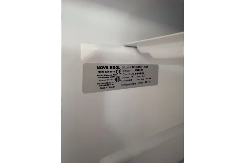 Slide: The Image of Label on Nova Kool RFU8000 12 DC refrigerator, manufactured in Canada, dated 04/08/14. - 68