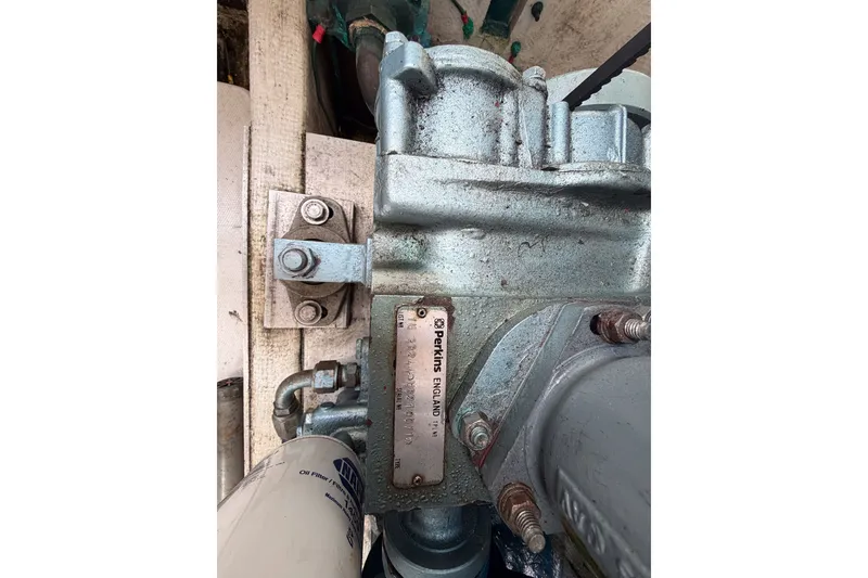 Slide: The Image of Close-up of a 1990 Cruise-A-Home Corsair engine component with Perkins branding. - 22