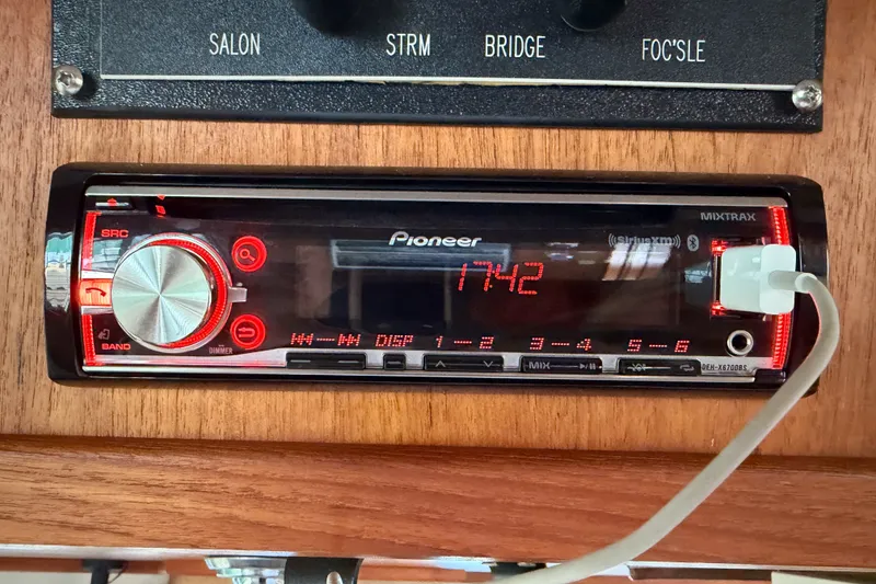 Slide: The Image of Pioneer stereo system in 1990 Cruise-A-Home Corsair boat, displaying time 17:42. - 39