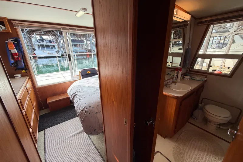 Slide: The Image of Interior of a 1990 Cruise-A-Home Corsair with bedroom and bathroom view. - 28