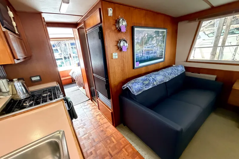 Slide: The Image of Interior of 1990 Cruise-A-Home Corsair with kitchen, sofa, and bedroom view. - 56