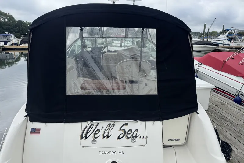 Slide: The Image of 2008 Sea Ray 290 Sundancer docked, rear view with black canopy, Danvers, MA. - 3