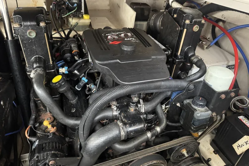 Slide: The Image of Engine compartment of a 2008 Sea Ray 290 Sundancer boat, showcasing mechanical components. - 20