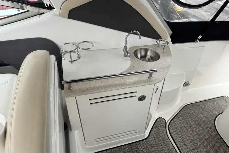 Slide: The Image of 2008 Sea Ray 290 Sundancer boat interior with sink and countertop. - 8
