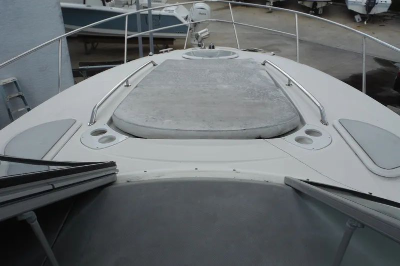 Slide: The Image of 2007 Monterey 330 Sport Yacht bow with sunpad and stainless steel railings. - 16