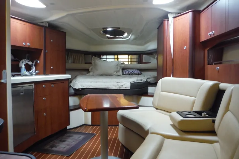 Slide: The Image of Luxurious interior of 2007 Monterey 330 Sport Yacht with cozy seating and elegant wood finishes. - 30