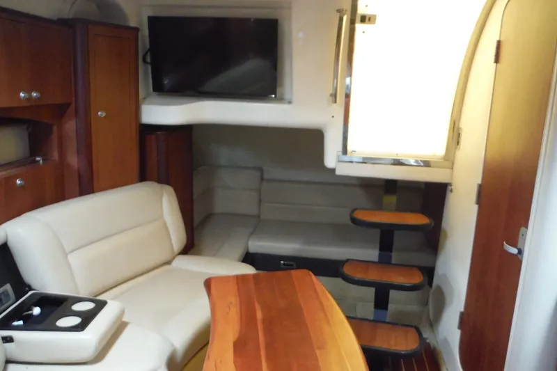 Slide: The Image of Interior of 2007 Monterey 330 Sport Yacht with seating, table, and TV. - 29