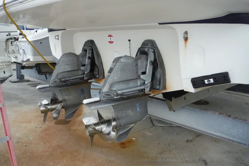 Slide: The Image of 2007 Monterey 330 Sport Yacht with dual propellers in a boatyard setting. - 6