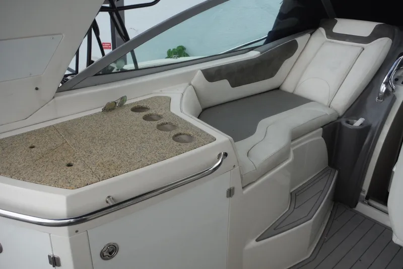 Slide: The Image of Luxurious seating area on a 2007 Monterey 330 Sport Yacht with cup holders and sleek design. - 11