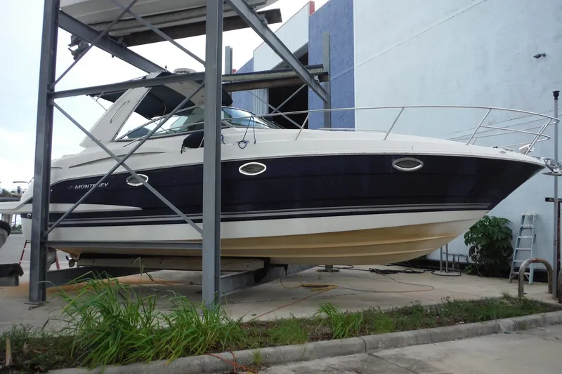Slide: The Image of 2007 Monterey 330 Sport Yacht on dry dock, side view. - 3