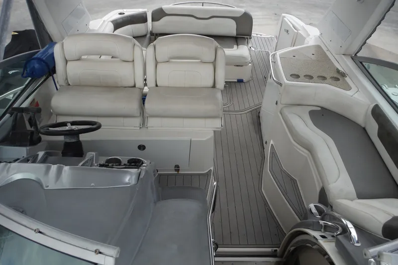 Slide: The Image of 2007 Monterey 330 Sport Yacht interior with spacious seating and modern helm. - 19
