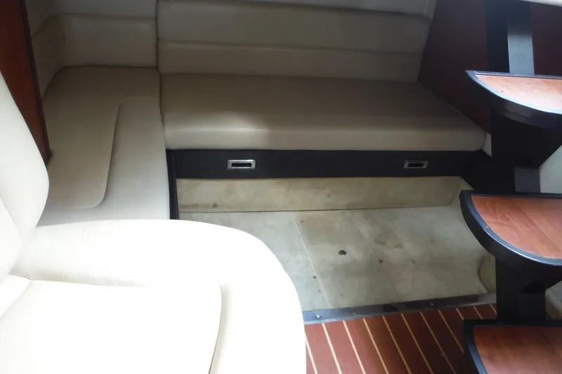 Slide: The Image of Interior of 2007 Monterey 330 Sport Yacht with beige seating and wooden steps. - 27