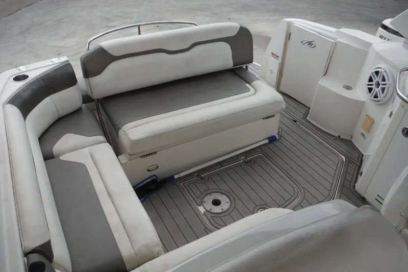 Slide: The Image of 2007 Monterey 330 Sport Yacht interior with cushioned seating and sleek design. - 15