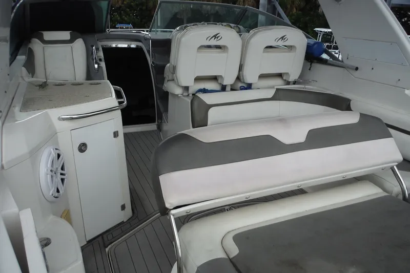 Slide: The Image of 2007 Monterey 330 Sport Yacht interior with seating and helm area. - 8