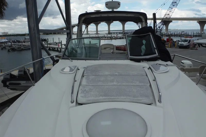 Slide: The Image of 2007 Monterey 330 Sport Yacht docked at marina with bridge in background. - 18