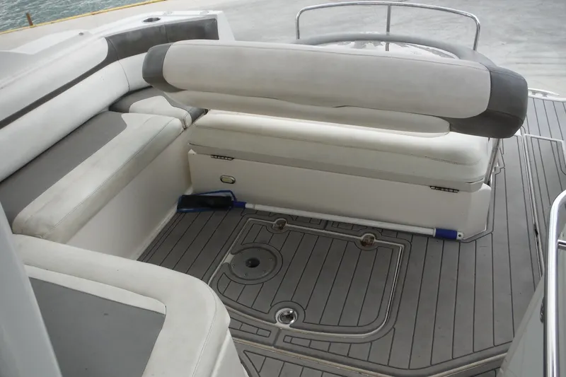 Slide: The Image of 2007 Monterey 330 Sport Yacht interior seating with gray and white upholstery. - 13