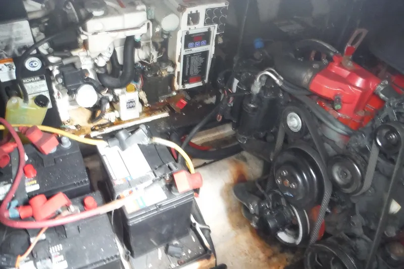 Slide: The Image of Engine compartment of a 2007 Monterey 330 Sport Yacht with visible batteries and mechanical components. - 38