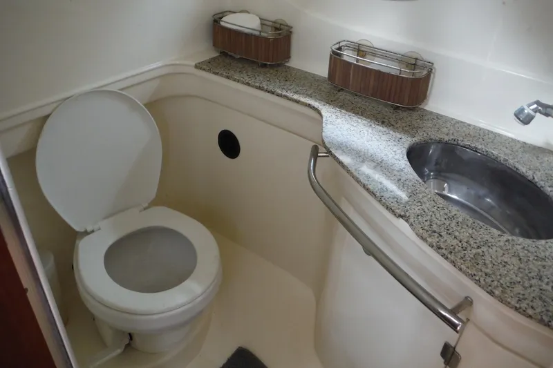 Slide: The Image of Bathroom interior of 2007 Monterey 330 Sport Yacht with toilet and granite countertop. - 25