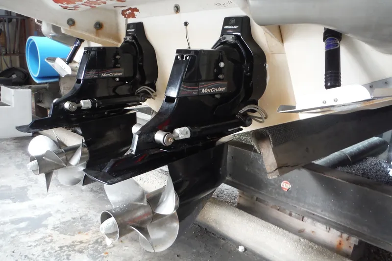 Slide: The Image of Twin MerCruiser outdrives on a 2007 Sea Ray 290 SLX boat in a workshop. - 42