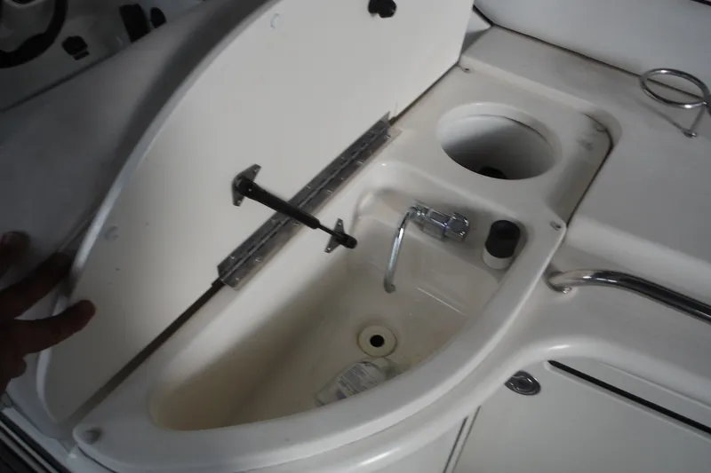 Slide: The Image of 2007 Sea Ray 290 SLX boat sink and storage compartment. - 39