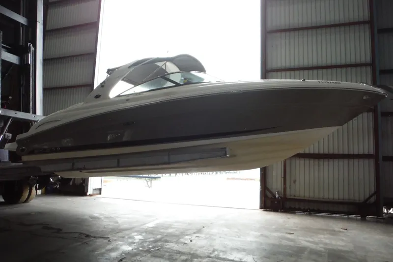 Slide: The Image of 2007 Sea Ray 290 SLX boat in storage facility, side view. - 6