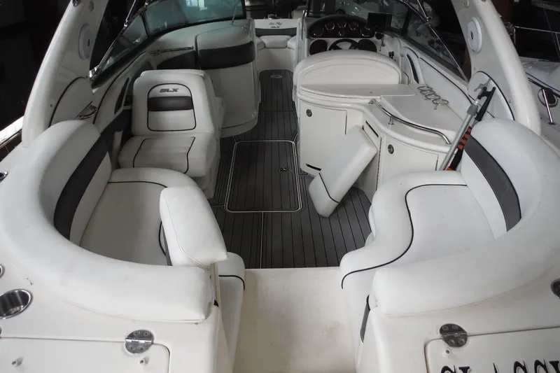 Slide: The Image of Luxurious interior of a 2007 Sea Ray 290 SLX boat with white seating and sleek design. - 10