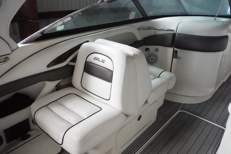 Slide: The Image of Interior of a 2007 Sea Ray 290 SLX boat with white seating and sleek design. - 13