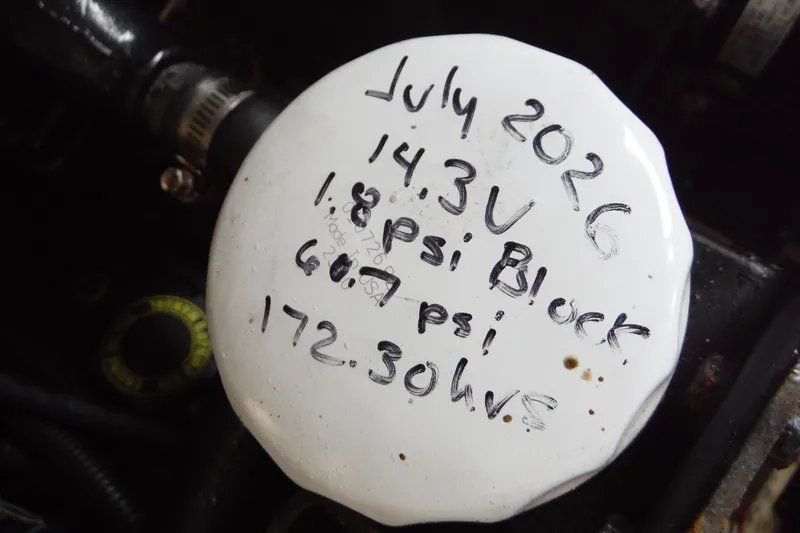 Slide: The Image of Engine component with handwritten notes, Sea Ray 290 SLX 2007, showing voltage and pressure readings. - 33